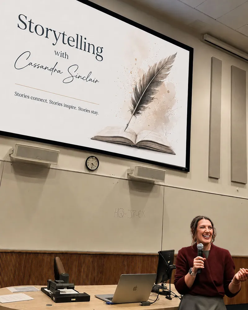 Cassandra Sinclair speaking at the University of Surrey, beneath a slide reading “Storytelling with Cassandra Sinclair”